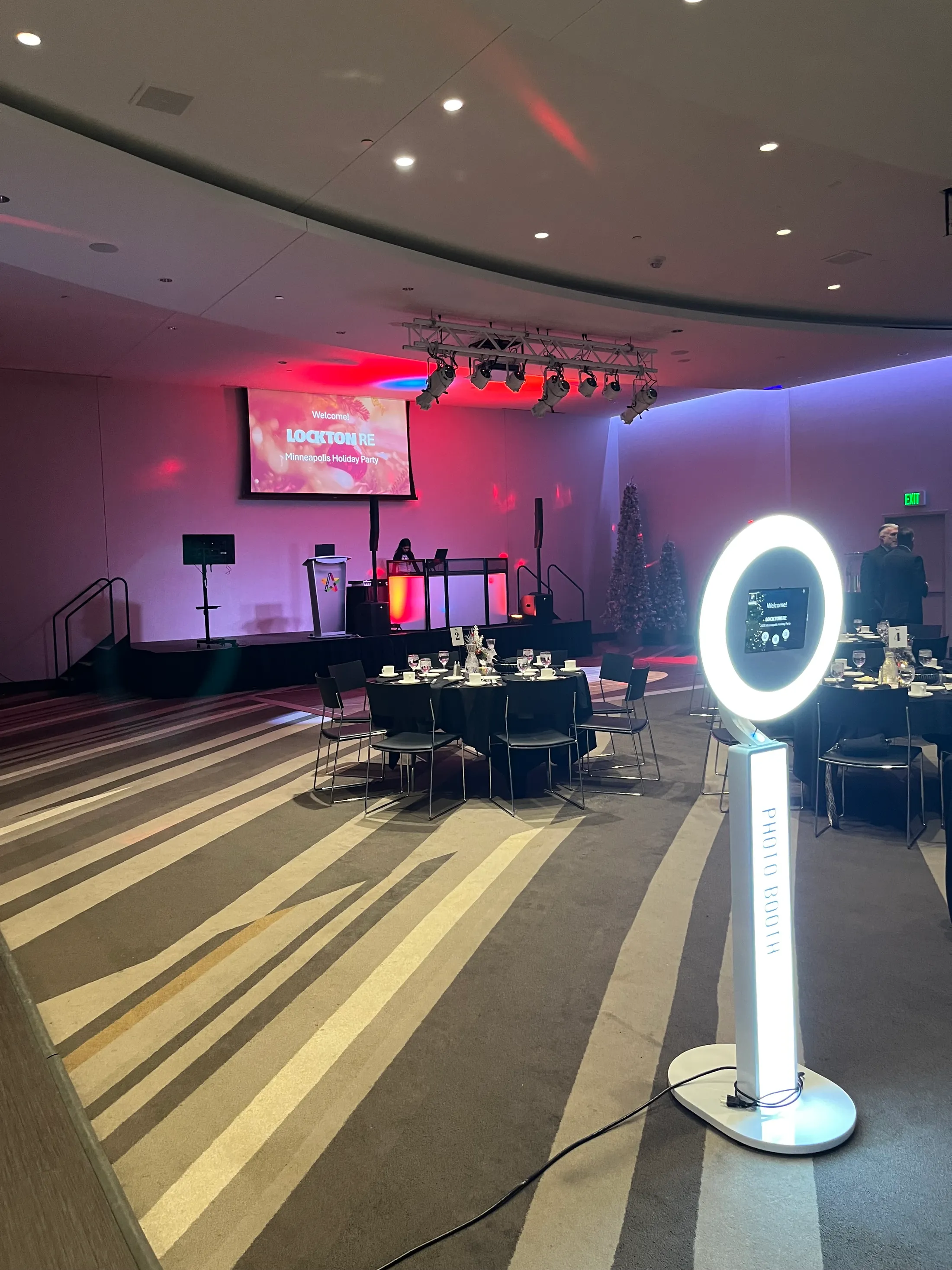 Full-scale corporate elegance. From the custom lighting and sleek DJ booth to our interactive photo booth, we transformed this Minneapolis holiday party into a total experience.
